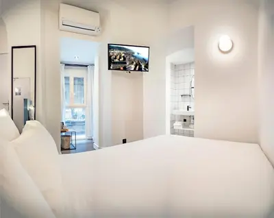 Un ou plusieurs lits dans un hébergement de l'établissement Monsieur Miot Concept Hotel - Bastia centre