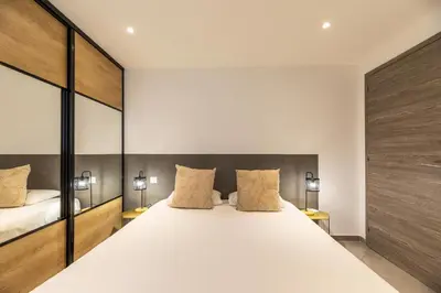 Un ou plusieurs lits dans un hébergement de l'établissement Casa u fornu Residence & Spa