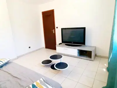 Télévision ou salle de divertissement dans l'établissement Gite libecciu