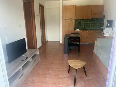 Télévision ou salle de divertissement dans l'établissement Moriani-Plage : Résidence en bord de mer