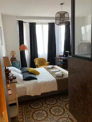 Un ou plusieurs lits dans un hébergement de l'établissement Hôtel La Demeure Coloniale