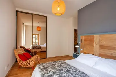 Un ou plusieurs lits dans un hébergement de l'établissement Maison de Charme-A STALLA- Entre Mer et Montagne