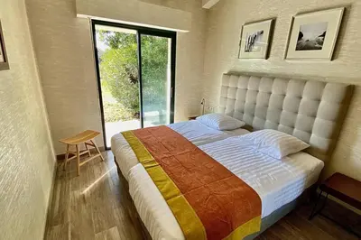 Un ou plusieurs lits dans un hébergement de l'établissement VILLA CORSA**** PISCINE VUE MER PANORAMIQUE