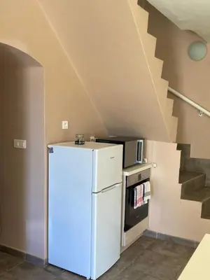 Cuisine ou kitchenette dans l'établissement DUPLEX 4 PERSONNES Clim Wifi Parking