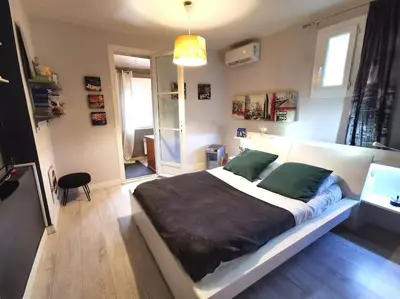 Un ou plusieurs lits dans un hébergement de l'établissement Casa Galli- Belle villa coeur de ville avc piscine