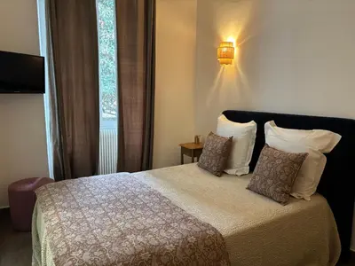 Un ou plusieurs lits dans un hébergement de l'établissement Hotel U Campanile