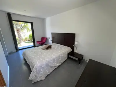 Un ou plusieurs lits dans un hébergement de l'établissement Villa Récente avec Piscine proche L'ILE ROUSSE