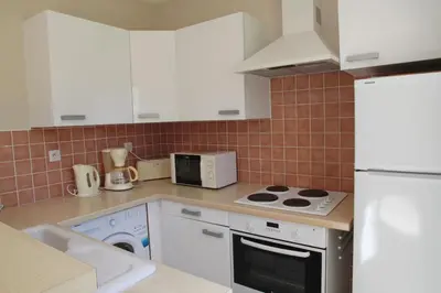 Cuisine ou kitchenette dans l'établissement Domaine Les 4 Vents