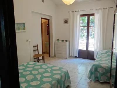 Un ou plusieurs lits dans un hébergement de l'établissement 2BA Domaine Malacucina Lumio