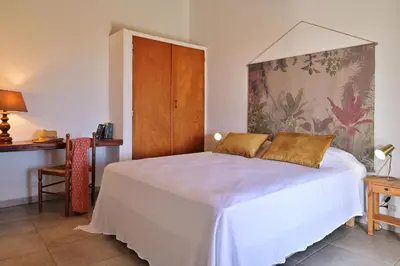 Un ou plusieurs lits dans un hébergement de l'établissement Domaine Punta della Guardia villa panorama maquis et mer, plage à 1,5 Km