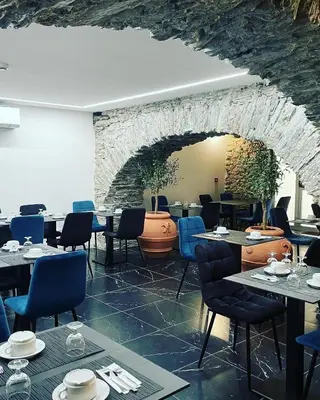 Coin salon dans l'établissement Hôtel Continental