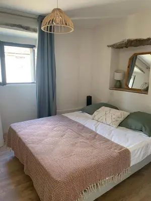 Un ou plusieurs lits dans un hébergement de l'établissement Très jolie maison aux portes du Cap Corse
