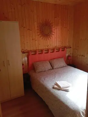 Un ou plusieurs lits dans un hébergement de l'établissement Chalet de Santa