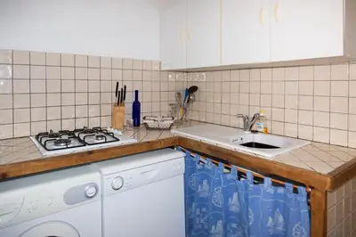Cuisine ou kitchenette dans l'établissement Appartements A Merendella