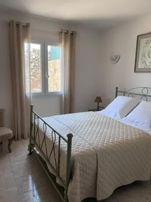Un ou plusieurs lits dans un hébergement de l'établissement Appartement rez de villa