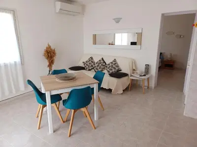 Coin salon dans l'établissement Vue sur mer - Appartement Les Pins