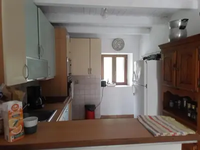 Cuisine ou kitchenette dans l'établissement Maison de caractère au coeur de la corse rurale