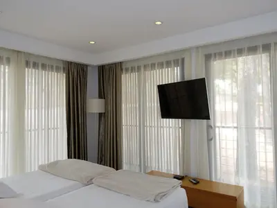 Un ou plusieurs lits dans un hébergement de l'établissement Holiday Home Villa en bois by Interhome
