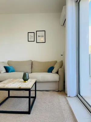 Coin salon dans l'établissement Corse - Bord de mer, Appartement neuf avec Piscine Chauffée