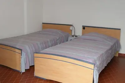 Un ou plusieurs lits dans un hébergement de l'établissement Appartement 8 pers. - Domaine de Padulone ALERIA