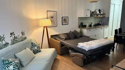 Coin salon dans l'établissement Studio pied dans l'eau - WIFI- Piscine