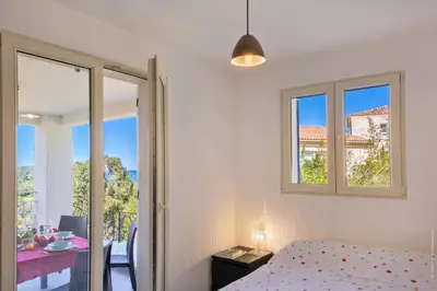 Un ou plusieurs lits dans un hébergement de l'établissement Appartement vue mer Fromontica