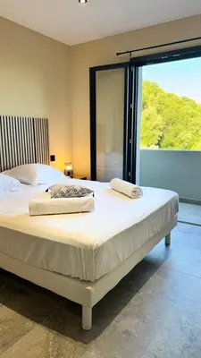 Un ou plusieurs lits dans un hébergement de l'établissement A CASA DI LAURENA piscine chauffée proche St Florent